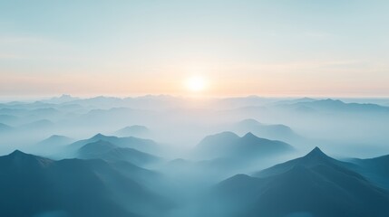 Fototapeta premium Majestic mountain landscape at sunrise with soft mist and warm light illuminating the horizon