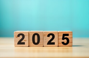 Wooden blocks show 2025. Year change concept. New year business planning. Financial forecast. Growth strategy. Target objective. Future success. Time management. Countdown. Start new project.