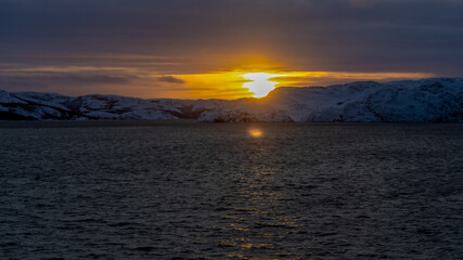 sunset over the sea in orange and yellow