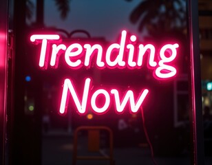 Naklejka premium Bright pink neon sign says Trending Now. Modern illuminated signage. Stylish urban decor. Perfect for nightlife marketing. Cool vibrant message. Trendy aesthetic. Digital art. Night glow. Sleek
