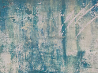 Blue and white wall with peeling and stained paint