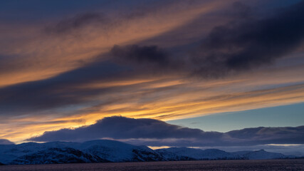sunset over the snowy mountains