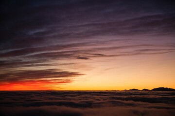 Spectacular sunset over a sea of clouds