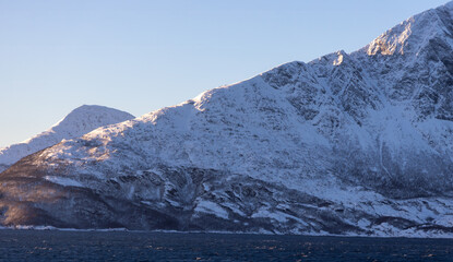 the day starts with a little ray of light on the mountains