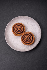 Freshly baked cinnamon roll with spices and cocoa filling