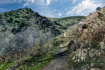 Pathway to the dam and hills of Patones.