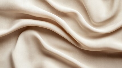 A close-up view of soft, draped fabric showcasing elegant folds and a smooth texture.