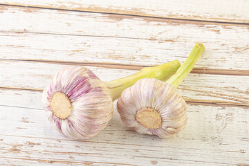 Two Young garlic over background