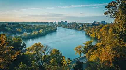 Obraz premium Stunning view of a river merging with a lake, surrounded by a lively city skyline and clear sky