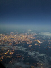 City Lights from Above at Twilight with Cloud Layers