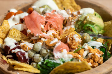 Poké salad with salmon, the Hawaiian style, Poke bowl with avocado and salmon. Spicy homemade salad, Poke bowls for balanced diet with