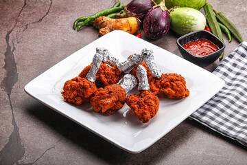 Indian cuisine glazed chicken lollipop