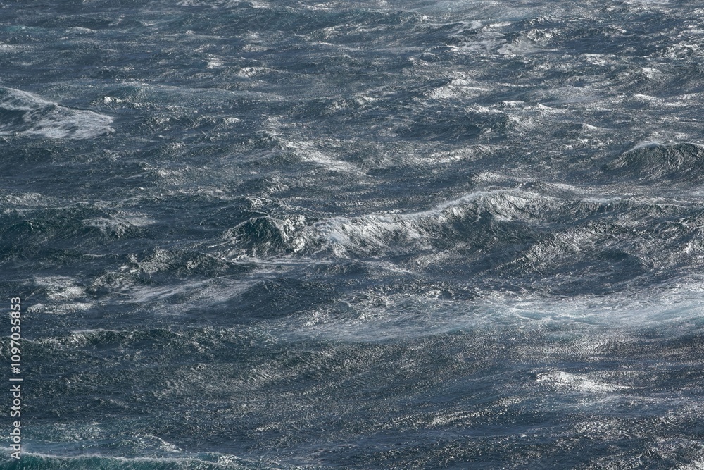 Poster image captures dynamic movement of ocean waves, showcasing interplay of light and water. turbulent s