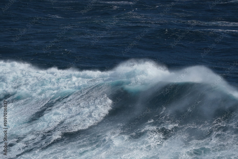 Poster powerful ocean waves crashing against each other, creating dynamic seascape filled with energy and m