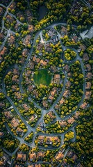 Aerial view of a suburban neighborhood with winding roads and green spaces.