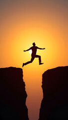 Silhouette of a man jumping between cliffs at sunset, symbolizing freedom and adventure