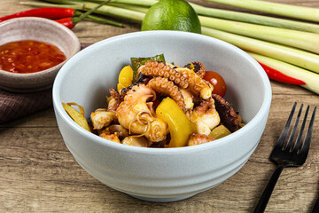 Roasted octopus with vegetables and oil