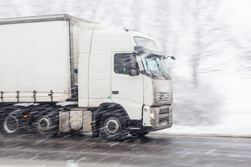 truck on the road in snow storm in uk
