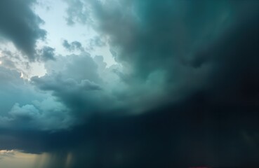 Fototapeta premium Dark heavy clouds gather before storm. Moody weather sky. Rain starts. Nature scene. Dramatic atmosphere. Bad weather. Typhoon clouds. Ominous sky. Abstract background. Grey cloudscape. Cloudy texture