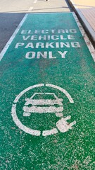 Obraz premium Charge sign on the road for electrical vehicle 