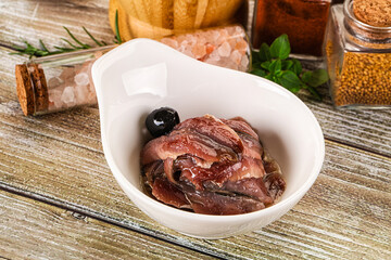 Canned anchovy with oil in the bowl