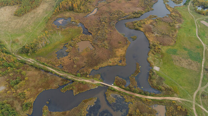 Wetland area with a road running through it