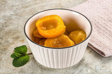 Canned marinated peach in syrop