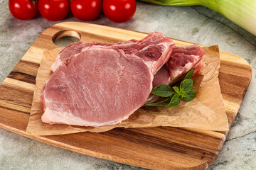Raw pork steak loin with bone