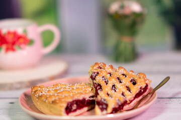 Cherry pie, A piece of cherry tart on a pink plate, Cherry tart homemade dessert, two pieces of shortbread with cherries on a pink plate