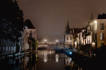 Obraz premium Saint Michael’s Bridge. Saint Michael's Church. Ghent, Flemish Region, Belgium. Mirror picture. Water reflection. Night picture.