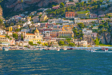 The photo captures a view of Positano, with its colorful, stacked houses cascading down the cliffs,...
