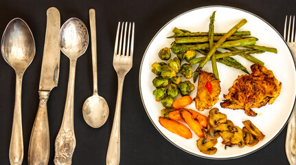 Real, strong, healthy, nutritious food, grilled chicken, pimenta biquinho, asparagus, mushrooms, Brussels sprouts and carrots.