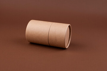 Minimalist Still Life with Books and Cardboard Tube Neutral Tones. minimalist composition featuring a stack of books in neutral colors with a cardboard tube on top, set against . High quality photo