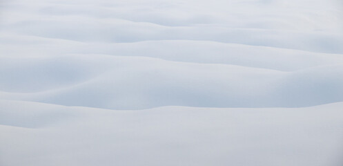 soft fluffy snow on uneven ground, snow texture
