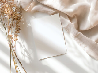 Minimalist Blank Card Mockup with Dried Flowers and Soft Fabric – Perfect for Wedding Announcements and Invitations