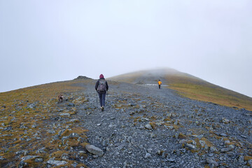 Hiking to the summit of Skiddaw in mist, Keswick, Lake District, UK