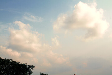 The sky during the day in summer and filled with cumulus clouds.