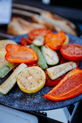 Grilled vegetables on a rustic plate, perfect for a healthy and colorful summer meal