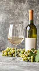Obraz premium Elegant wine setup with bottle, glass, and fresh grapes on a marble countertop