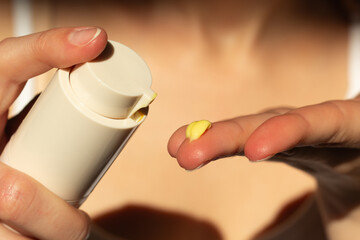 Closeup of person applying retinal serum.
