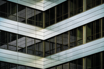 Modern Geometric Facade with Glass and Metal Louvers