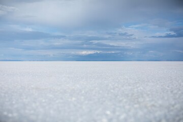 Serene views of the Utah salt flats on a partly cloudy day.