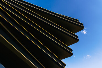 New Masarycka building in Prague, Modern Architectural Facade with Dynamic Curves and Reflective Glass Panels