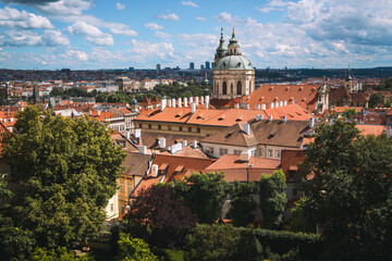 Fototapeta premium Scenic View of Malá Strana Rooftops and St. Nicholas Church in Prague