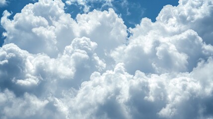 Beautiful white fluffy clouds against bright blue summer sky. Natural cloudscape background for weather forecast, climate change, atmosphere and meteorology concepts