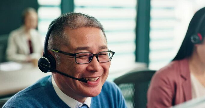 Man, call centre and speaking in Japan office, representative and computer for customer service. Mature person, telemarketing and online for global guide in workplace, networking and website for faq