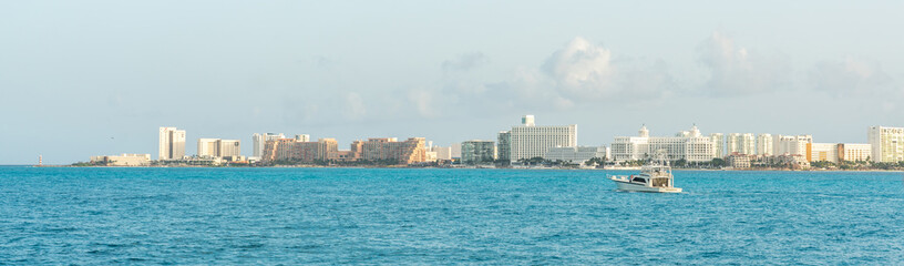 Panoramic view of Cancun coastal skyline, featuring modern architecture and turquoise sea under a bright sunny sky. Concept of luxury and relaxation in a tropical destination