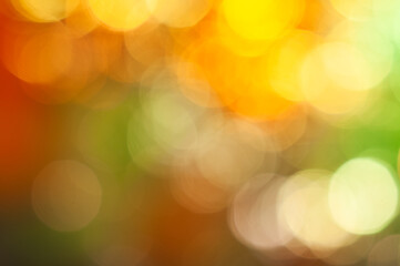 Warm and vibrant bokeh lights create an abstract evening atmosphere using soft focus