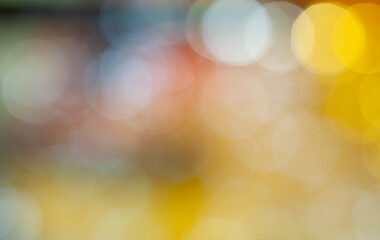 Warm golden bokeh lights create a festive atmosphere in a cozy indoor setting