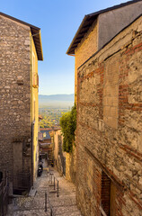 Naklejka premium A stone staircase leads up a narrow street in an Italian village